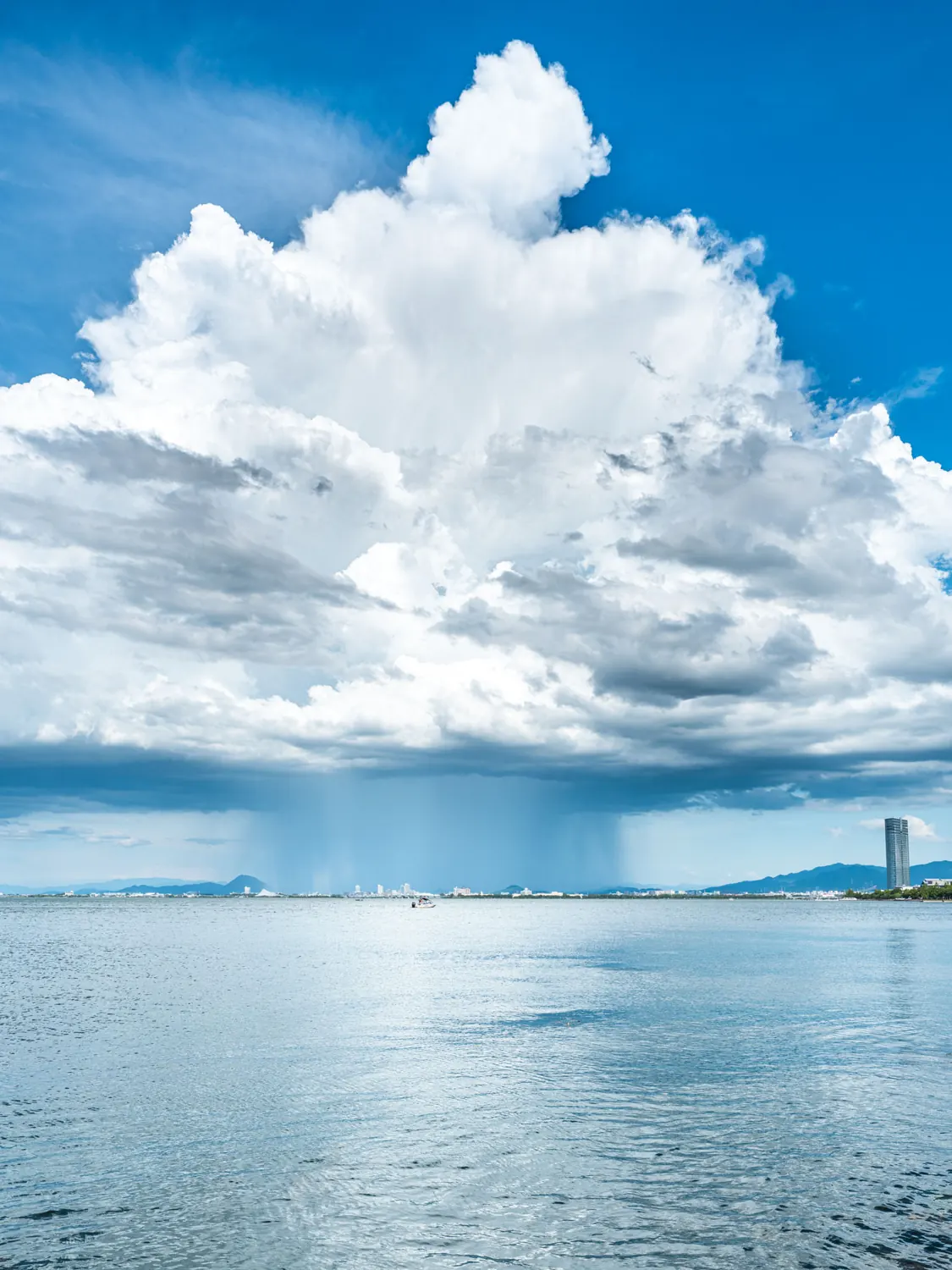 Cumulus clouds over a summer lake