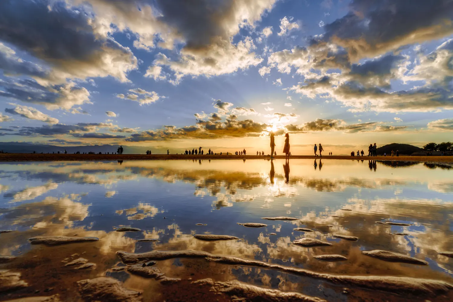 Dramatic sunset clouds reflected on water